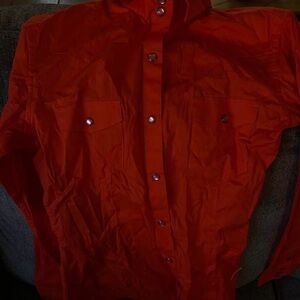 Woman’s PanhandleOrange button down shirt